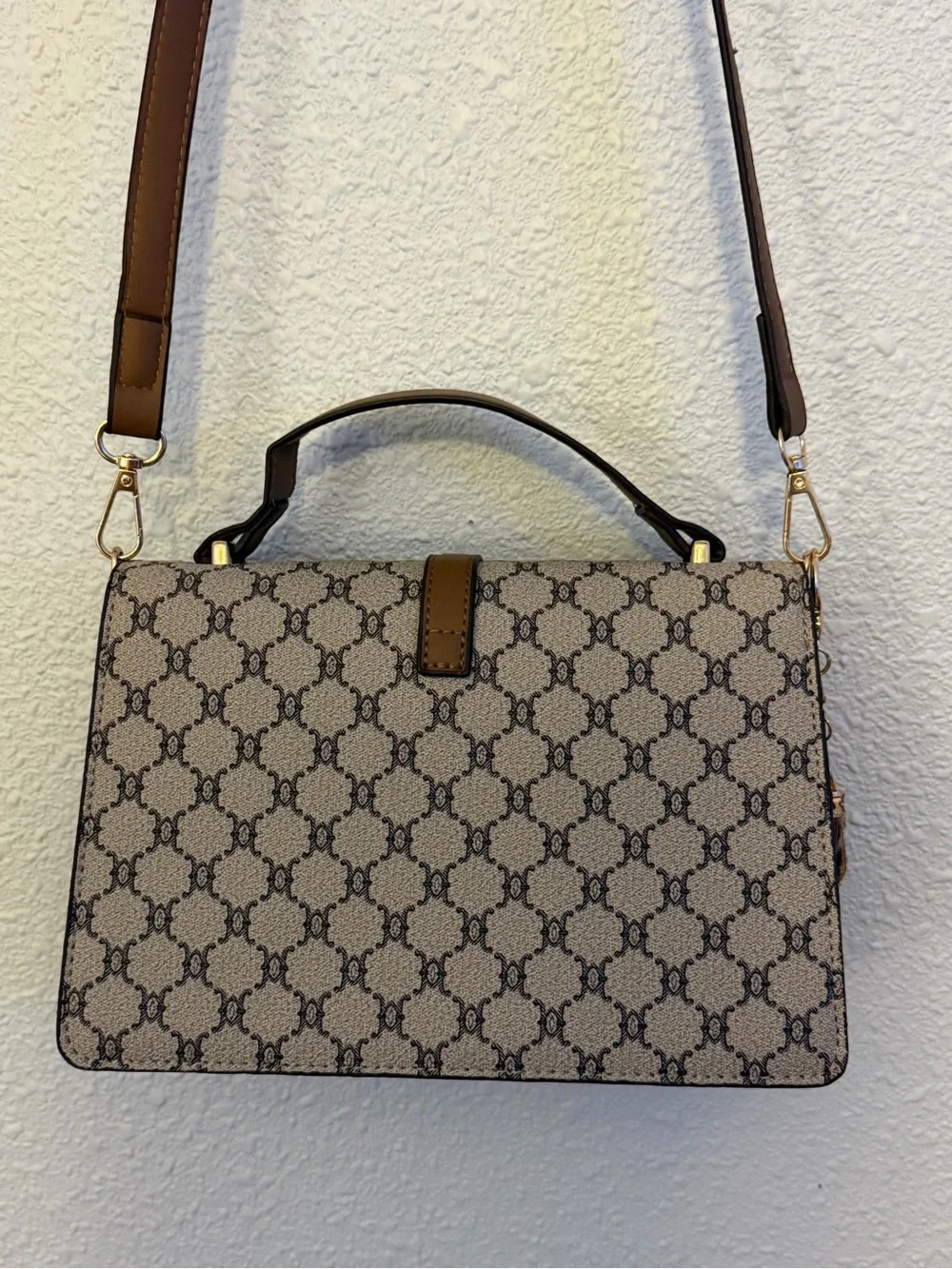 Beige Brown Monogram Shoulder Bag with Gold Buckle with a matching wallet.